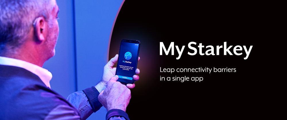 Man holding phone with My Starkey app on screen